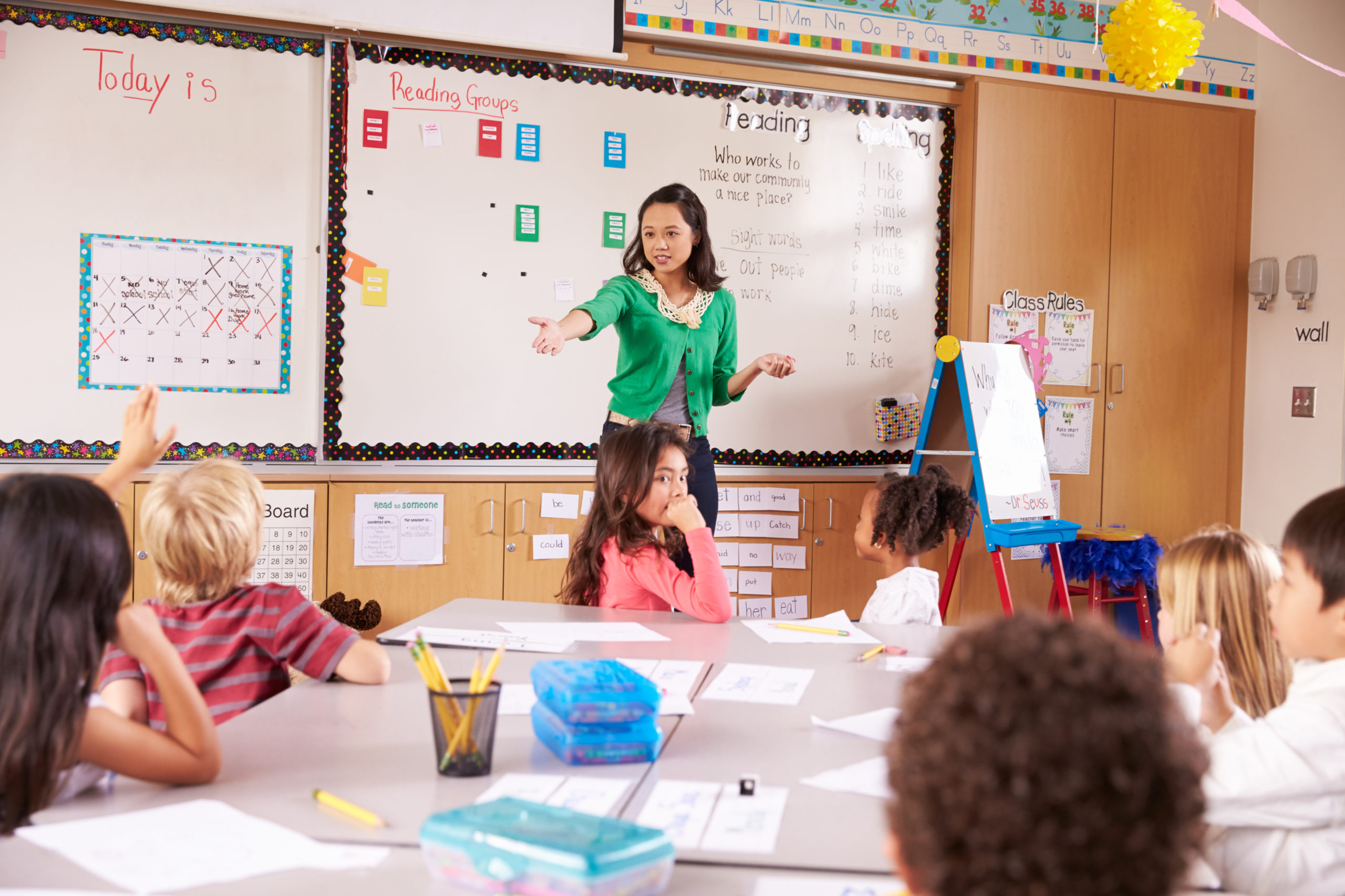A K-12 teaching knowledge to young students in a classroom
